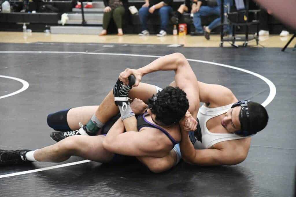 Photo - Madera South’s 195-pounder Angel Castellanos works his opponent into a pinning position during Friday’s Div. III Championships at Madera South. Castellanos eventually placed third to help the Stallions to a runner-up team finish.