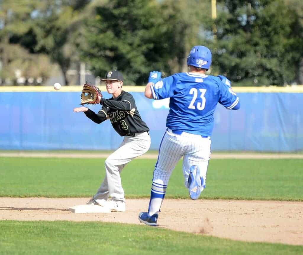 Photo - Liberty freshman second baseman Jakson Bucher receives a throw at second to force out oncoming Madera runner Tommy Molina during Tuesday’s victory over the Coyotes.
