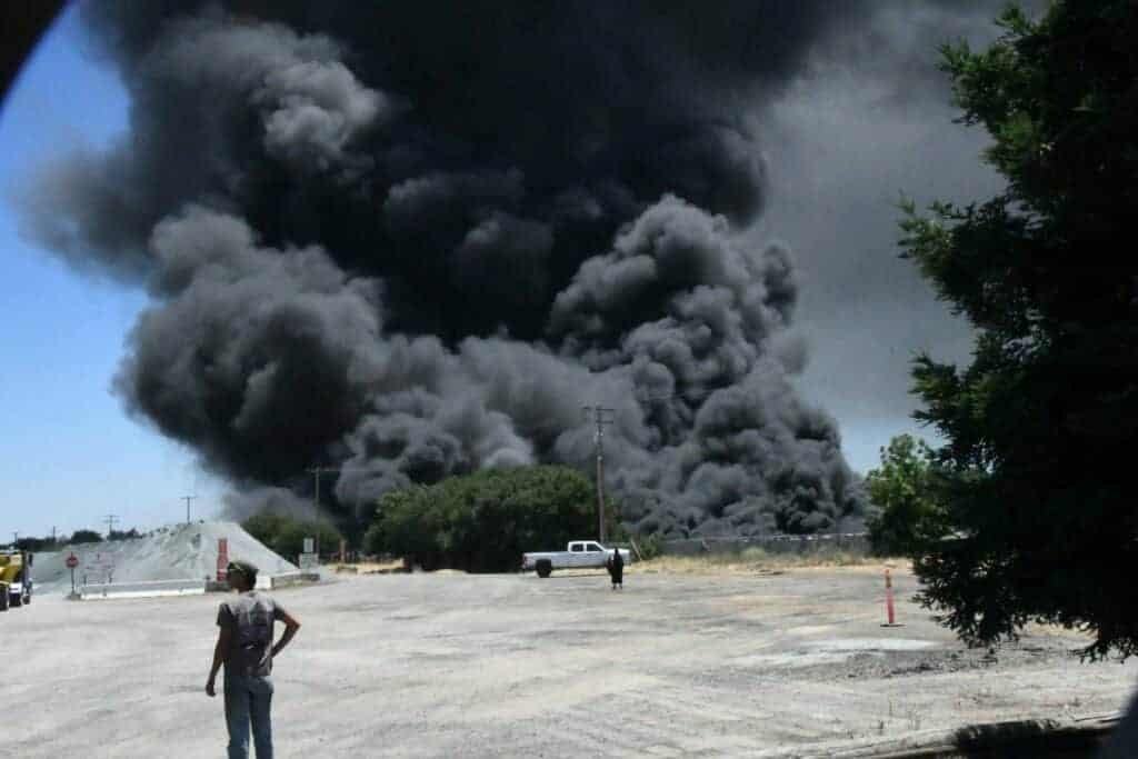 Photo - Black smoke could be seen for miles right outside the Madera city limits early Monday afternoon.