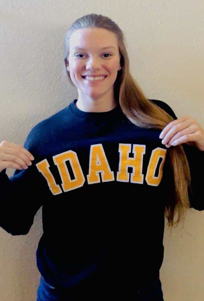 Photo - Madera Coyotes record breaking swimmer Tara Goertzen shows off her University of Idaho sweatshirt where she will be attending and swimming for in the fall.