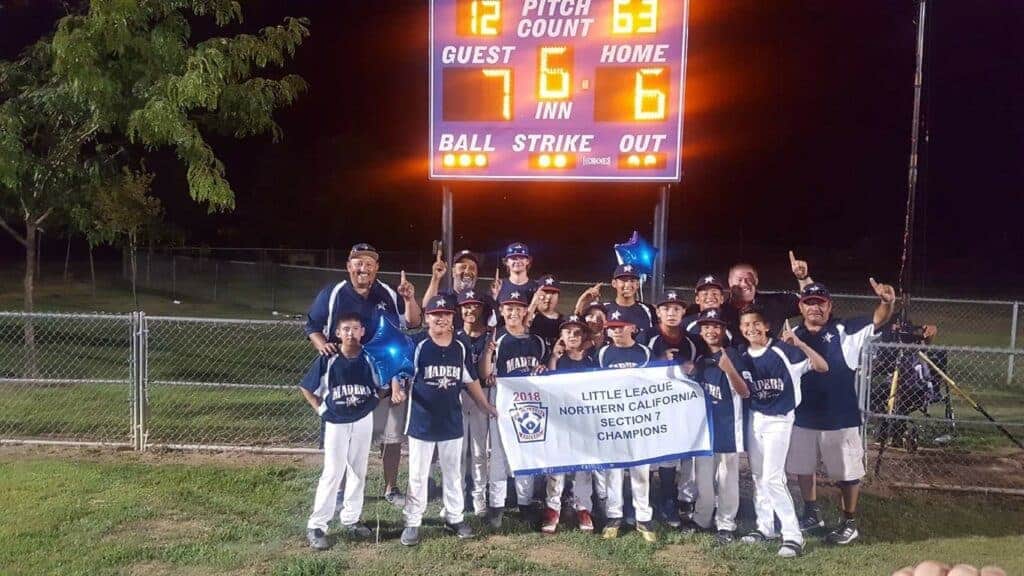 Photo - The Madera American Little League 12-year-old All-Star team clebrates winning the Northern California Section 7 championship Sunday in Arvin.