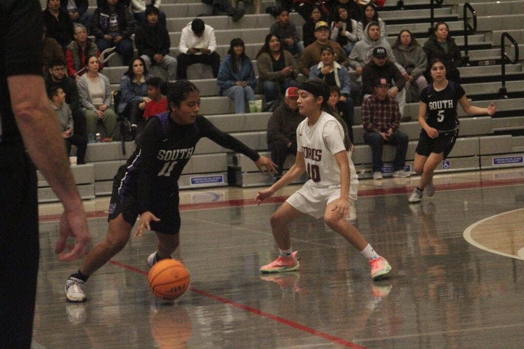 Photo - Madera South’s Mayrlin Vasquez tries to get past Torres’ Nevaeh Chavez during Saturday’s championship game. Vasquez earned All-Tournament honors by averaging 8.7 points and 6.3 rebounds over three games for Madera South.