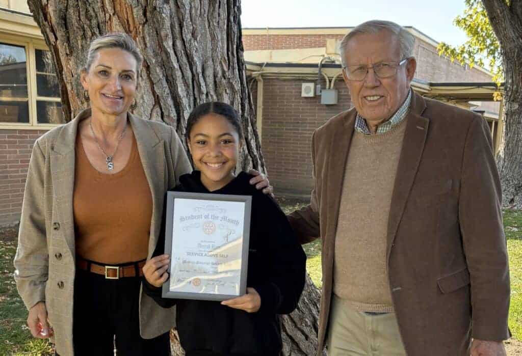 Photo - Sandra Kelly of Thomas Jefferson Middle School, left, stands with honoree Aniyah Hain, middle, and Joe Vived of Madera Sunrise Rotary.