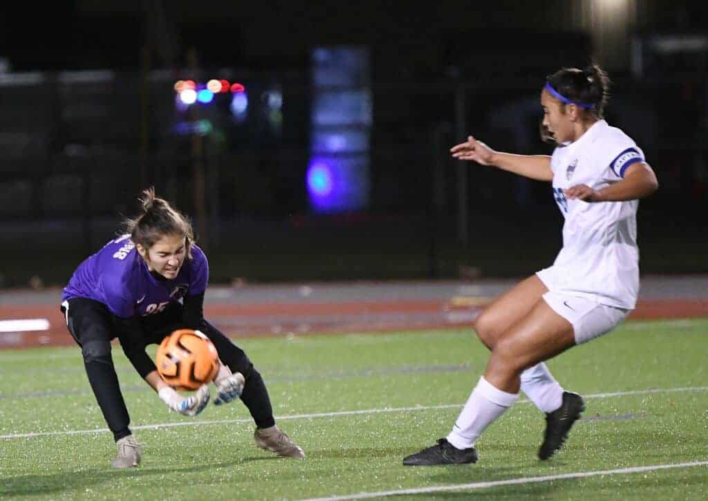 Photo - Madera South goalkeeper Melani Rinder comes out to make a save in Tuesday’s loss to Clovis. Rinder made her share of saves in Wednesday’s 4-1 victory over Kerman.