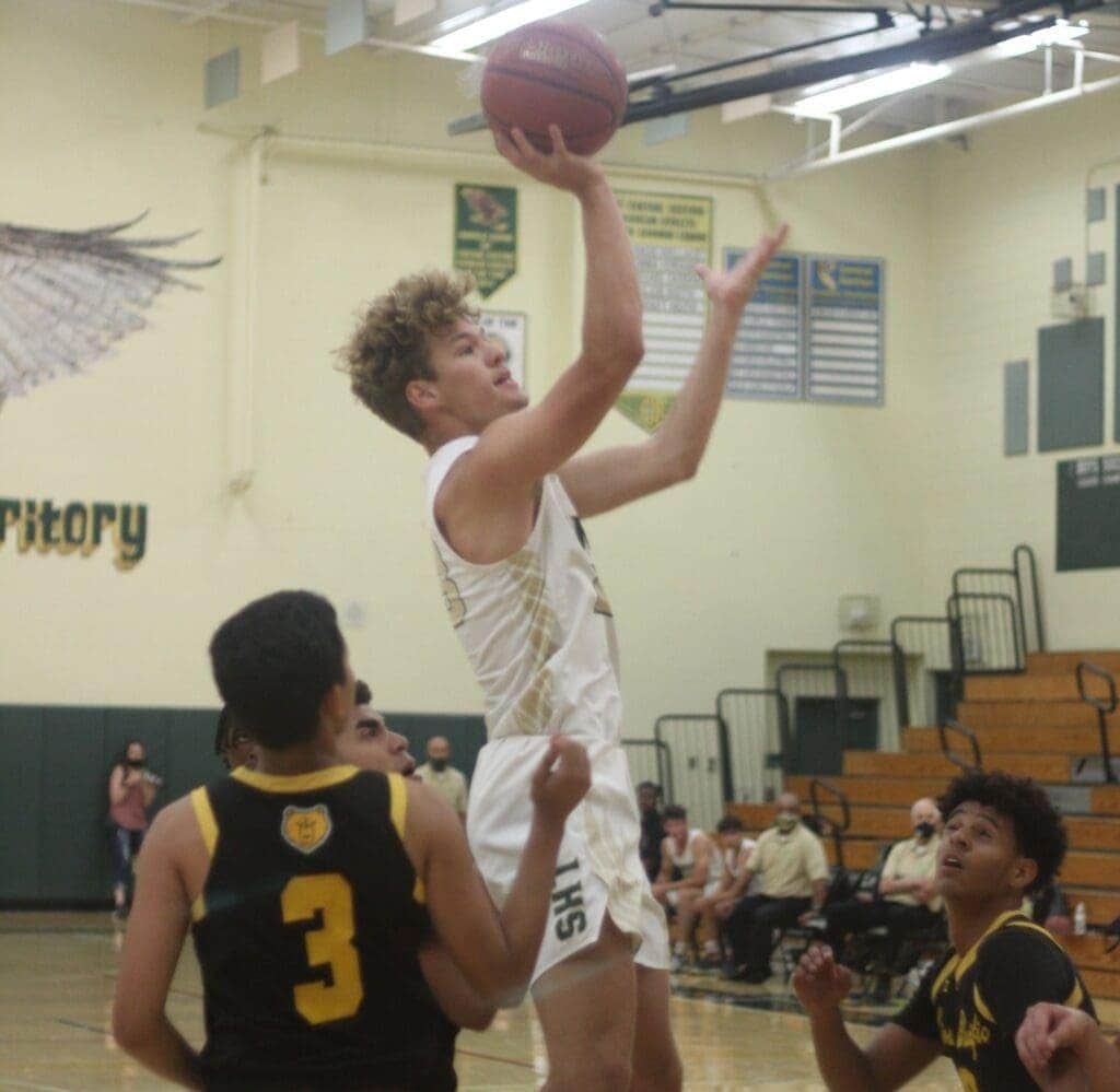 Photo - Liberty’s Carson Stephens rises up to score two of his game-high 25 points in Friday’s playoff victory over Sierra Pacific.