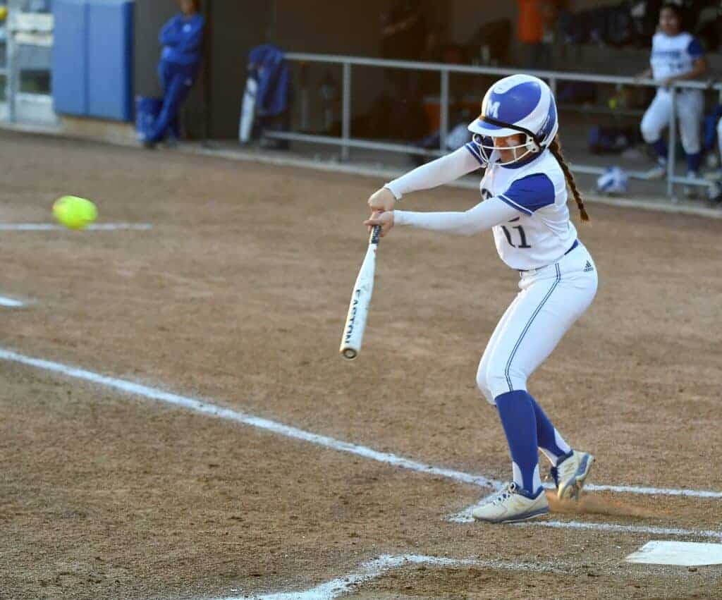 Photo - Madera’s Brilynn Santiago singles in the first inning of Monday’s 8-5 victory over Golden Valley. She led the Coyotes with three runs.