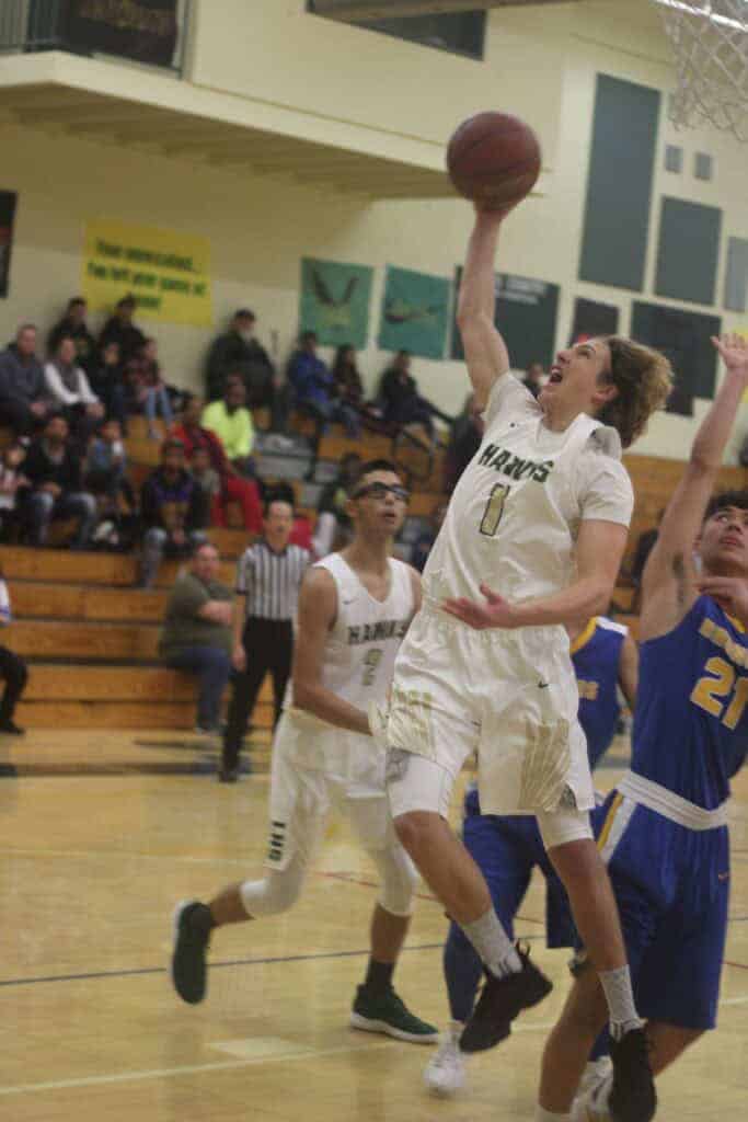 Photo - Liberty guard Gary Afonin scored 13 points in a 71-66 victory Saturday over the Firebaugh Eagles at Edison High School.