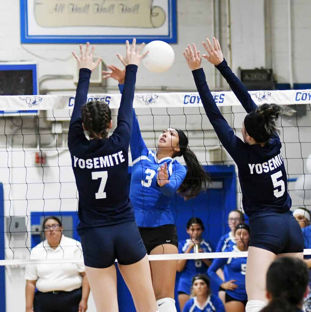 Photo - Madera’s Isabella Saucedo gets a kill past the arms of he Yosemite blockers during Tuesday’s match. Saucedo recorded a team-high 11 kills in the loss.