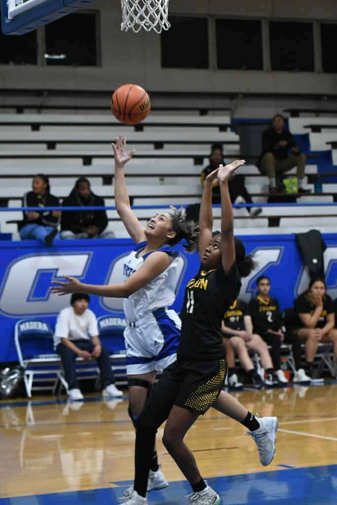 Photo - Madera’s Rhynne Mitchell drives to the hoop for a shot during Friday’s victory over Edison, Mitchell scored seven points in the victory.