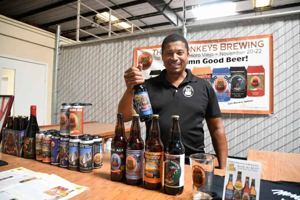 Photo - Michael Tate, president of Three Monkeys Brewing, displays one of his Yosemite Falls IPA beers.