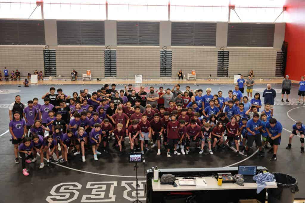 Photo - Madera Unified CARD wrestling participants from all three pyramids (Blue- Madera; Purple- Madera South; and Red- Matilda Torres) gather together after participating in a camp.