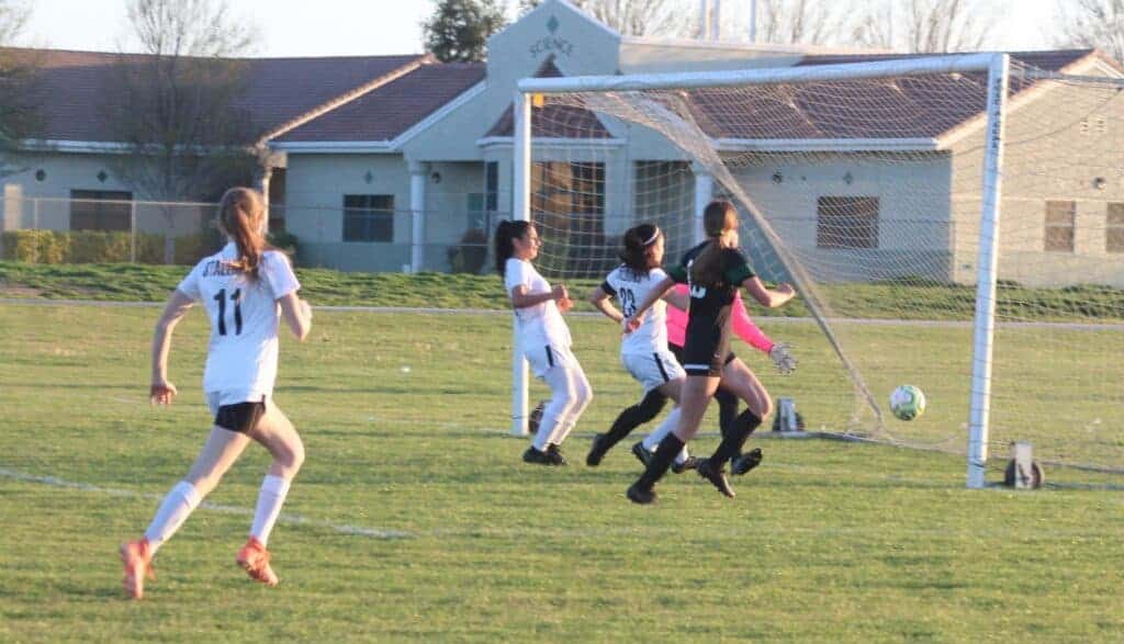 Photo - Madera South’s Breanna Maciel (23) knocks the game-winning goal by Liberty goakeeper Carly Tynan in the 15th minute of overtime Tuesday.