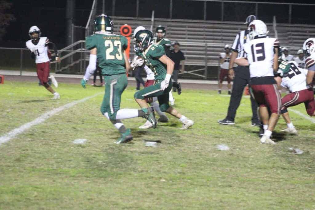 Photo - Liberty running back Mitchell Whaley gets an escort from Dominic Castaneda to score Friday’s first touchdown in a 27-0 Div. V first-round playoff victory over Cesar Chavez.