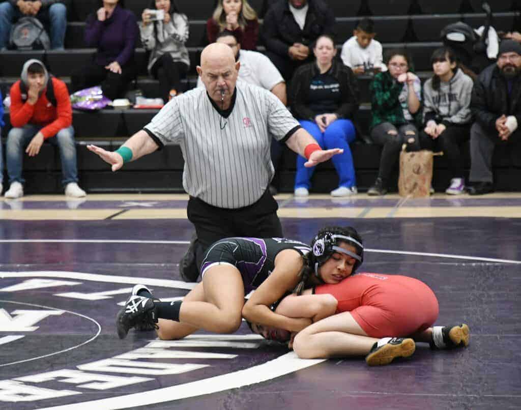Photo - Madera South senior Emily Zamudio works her Kerman opponent into a pin during Tuesay’s dual match. Zamudio’s pin gave the Stallions the dual meet victory on Senior Night.