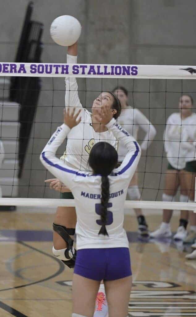 Photo - Liberty’s Emma Del Toro rises up to get a kill past the Madera South block during Thursday’s three-set sweep over the Stallions.