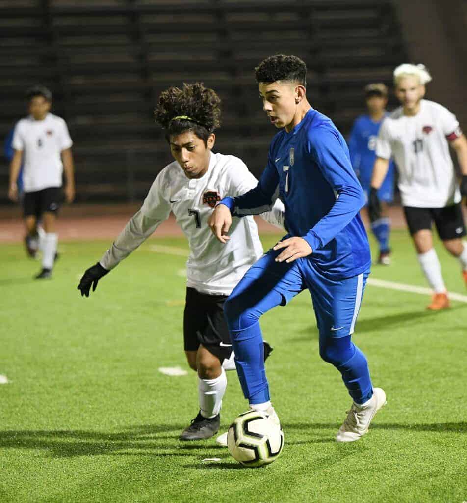 Photo - Madera’s Nick Gonzalez battles a Selma defender for possession during Friday’s 2-2 tie. Gonzalez scored the game-tying goal in the final seconds of the match.