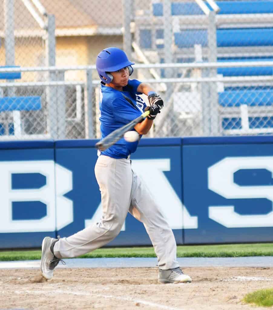 Photo - Babe Ruth 14-year-old All-Star Brian Monges singles in the second inning of Monday’s scrimmage against the 15-year-old all-Stars. Monges scored a pair of runs in a 13-12 victory at Mel Parker Field.