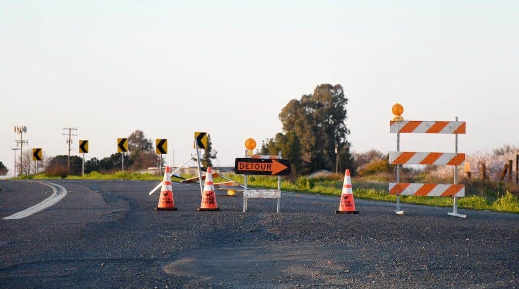 Photo - Detour signs redirect traffic along Tozer Street as a closure is in effect for the next two to three weeks to perform repair work on an MID canal line.