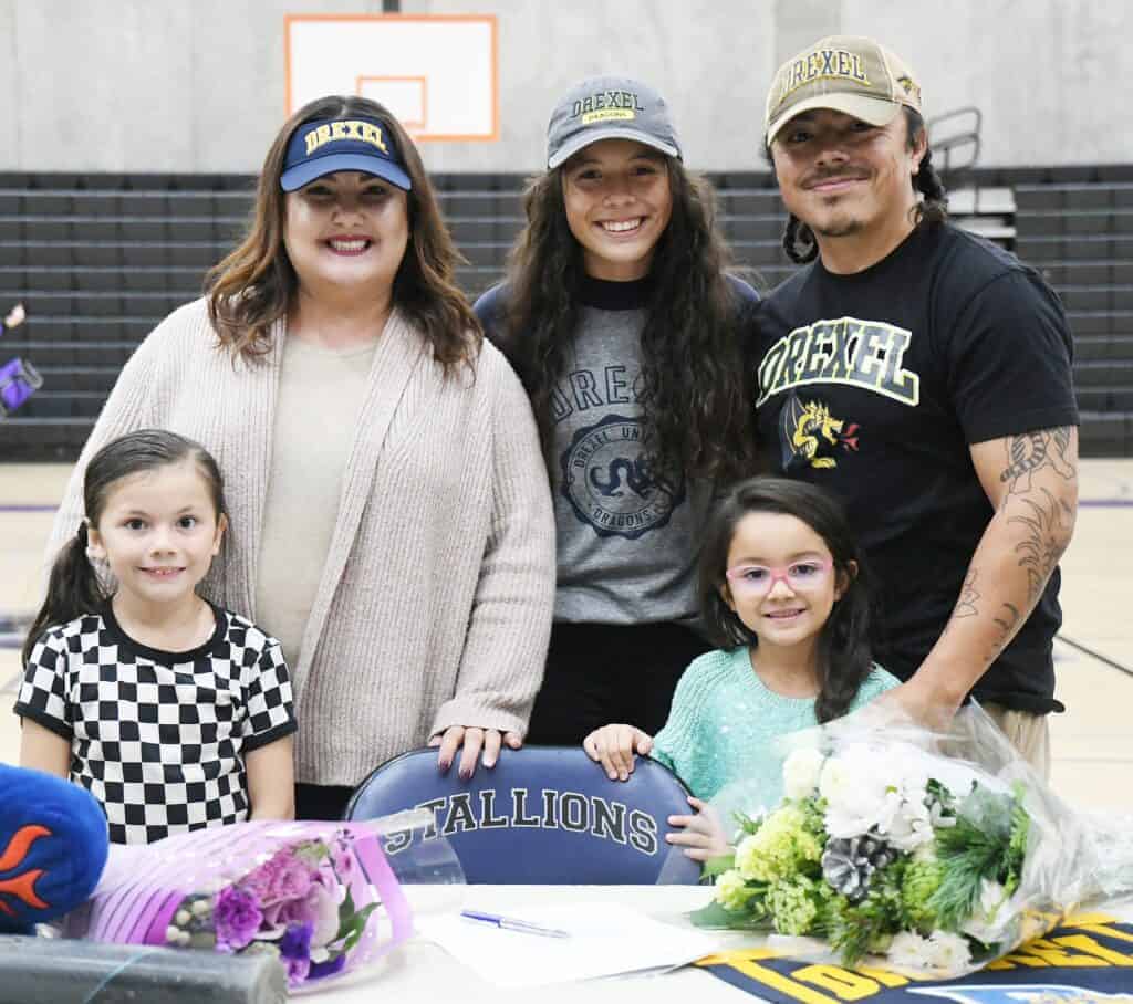 Photo - Madera South softball player Savaanah Garcia, back middle, and her family are all smiles after Garcia signed her National Letter of Intent to Drexel University