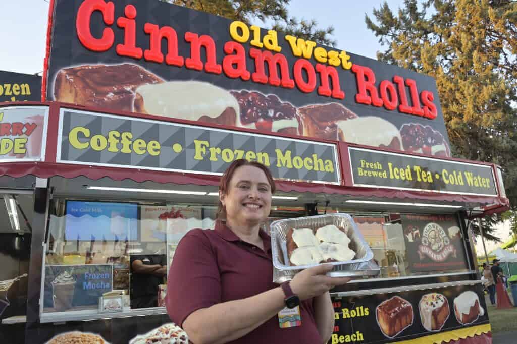 Photo - Alexis Parkhurst of Old West Cinnamon Rolls. The Madera District Fair inviting fairgoers to have their fill of crowd-favorite fair treats — all for just five bucks with its all-new $5 Fair Food Happy Hour.