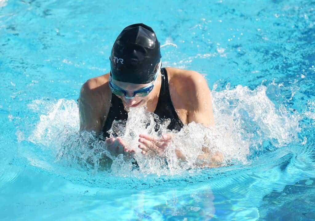 Photo - Madera’s Abby Poore swims the breaststroke during Friday’s dual meet with Sanger. Poore placed second to teammate Katie Ylarregui and also set a personal record in the 50-yard freestyle.