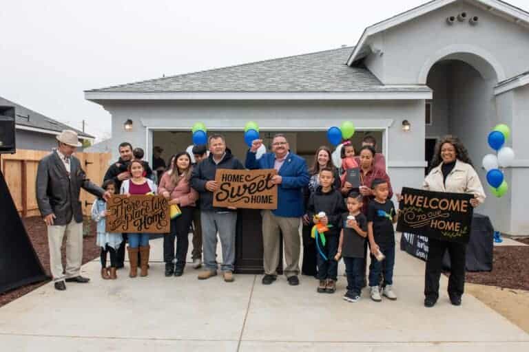 3 families receive keys to homes just in time for Thanksgiving