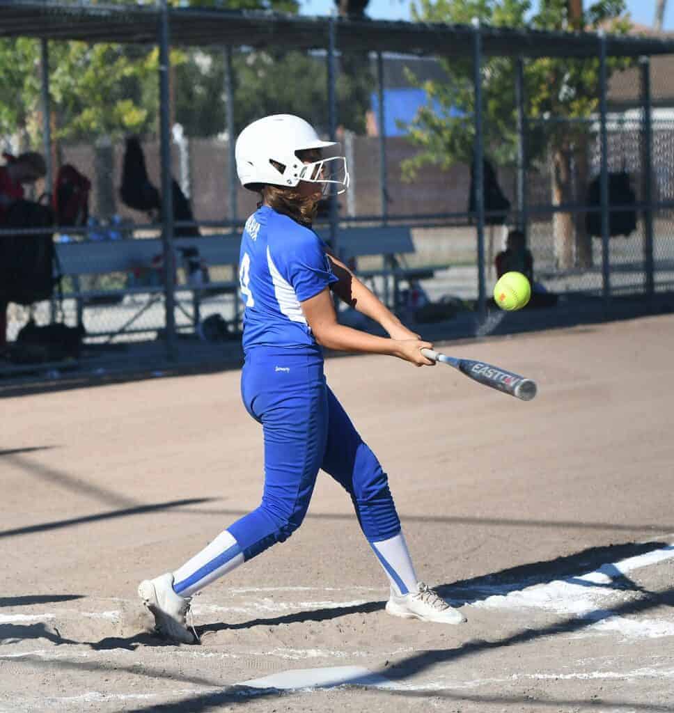 Photo - Madera National’s Jordan Anaya gets a hit to lead off the second game against Turlock National in the Valley Section Championship game on Saturday.