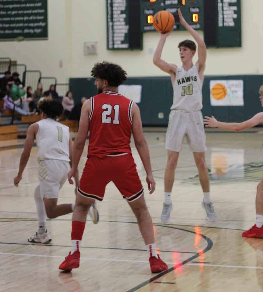 Photo - Liberty’s Titus Johnson shoots a 3-pointer during Friday’s loss to Chowchilla. Johnson scored a team-high 20 points, including making his first high school dunk. 