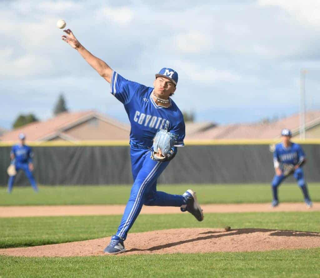 Photo - Madera’s Jaydian Chavira throws one of his 82 pitches during a Tuesday shut out of the Madera South Stallions. He struck out 11 and scattered six hits in a 10-0 victory at Eddie Chapa Field. 