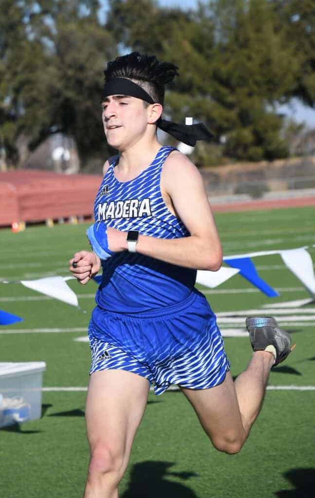 Photo - Madera’s Naisaiah Reyes battles to a second place finish in Wednesday’s dual meet race against Sanger.