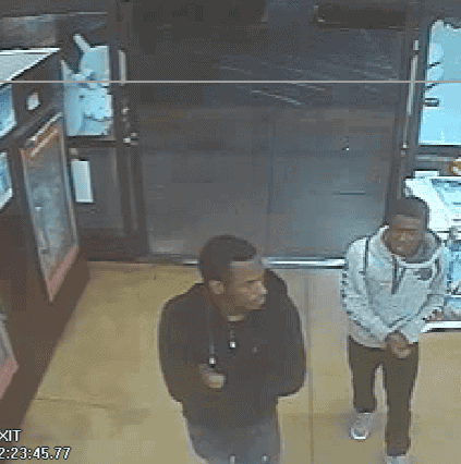 Photo - This clip from surveilance camera footage shows two men suspected of attempting to carjack a woman in the parking lot of Food 4 Less on July 11.