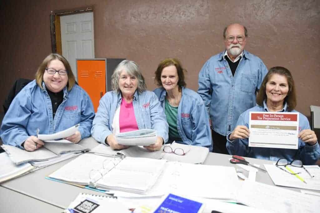 Photo - AARP Tax Aide volunteers from left, Rose Aguayo. Sarah Titus, Sharon Stroemer, Bob Musick and Anna Hardy are preparing for this year’s Free In-Person Tax Preparation Service.