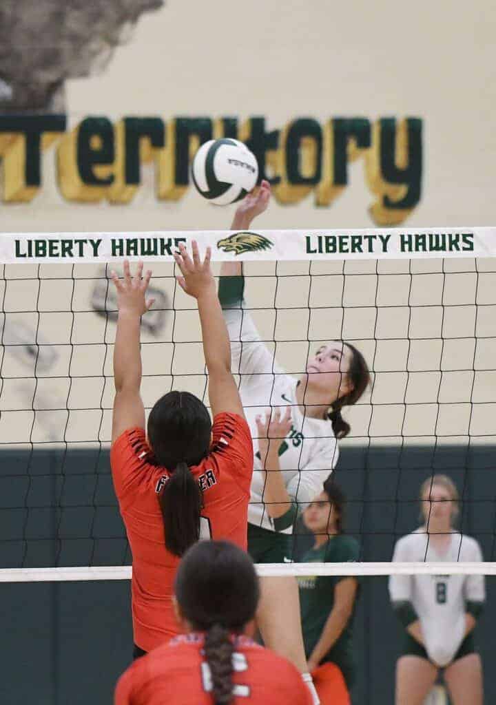 Photo - Liberty’s new outside hitter Karsyn Bauer goes up for a kill during Tuesday’s four-set win over Fowler. Bauer led the Hawks with 19 kills after recently moving into the position.