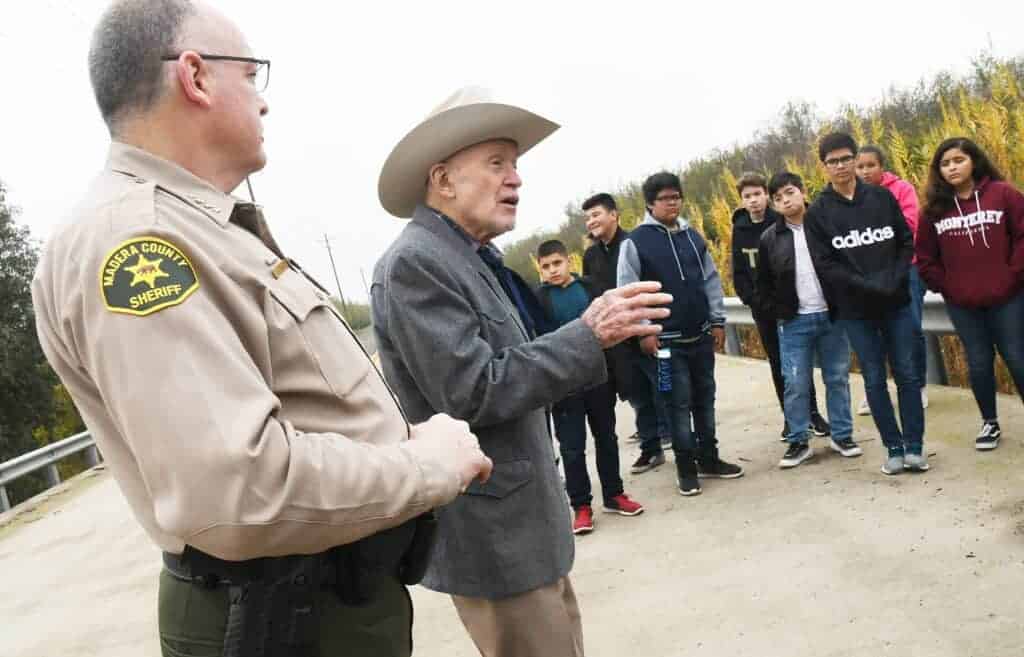 Photo - Former Madera County Sheriff Ed Bates meets with Dixieland students at Berenda Slough to tell them what he remembers about the Chowchilla Kidnapping. At left is current Madera County Sheriff Jay Varney.