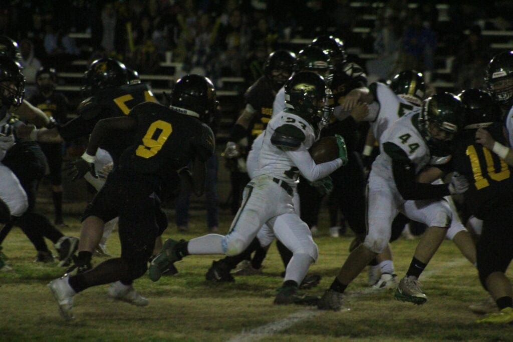 Photo - Liberty’s Dominic Castaneda runs behind a Max Nulick (44) block en route to a 46-yard touchdown run for the Hawks’ first score in Friday’s upset victory over Boron.