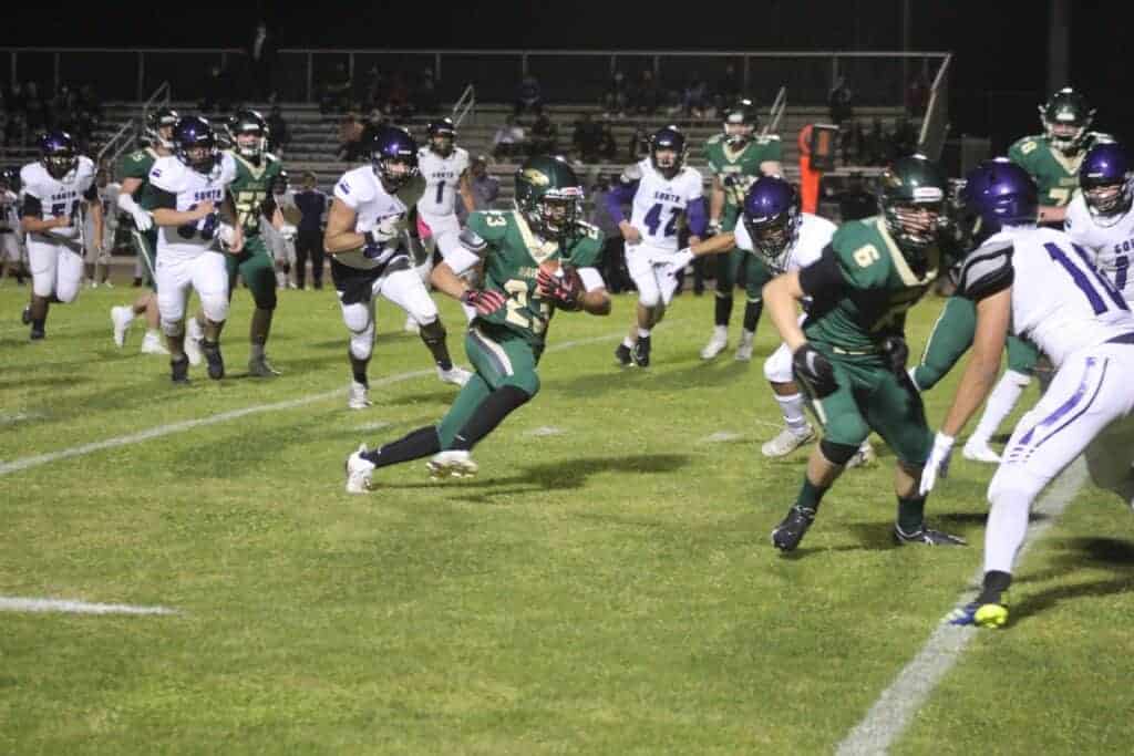 Photo - Liberty’s Dominic Castaneda finds some running room in Friday’s victory over Madera South. Castaneda scored two touchdowns and rushed for 98 yards in the win.