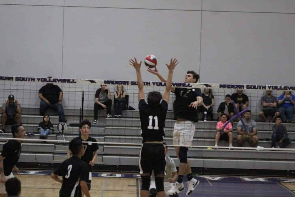 Photo - Madera South’s Christian Sylvia gets the ball over the net during Thursday’s three-set sweep over the Edison Tigers in the Div. II Central Section semifinals. Sylvia recorded nine kills in the victory.