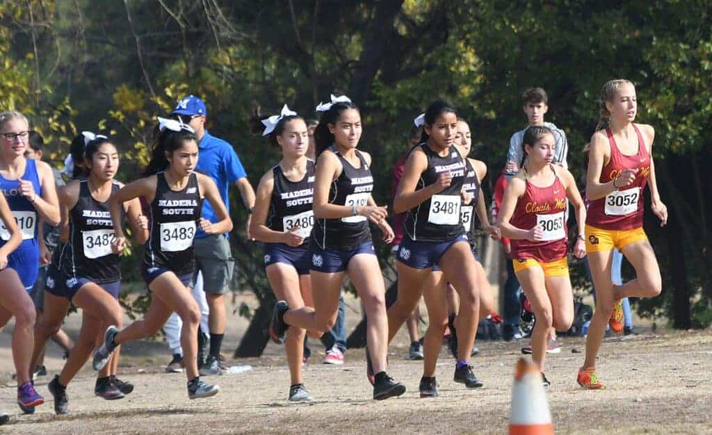 Photo - The Madera South Stallions girls cross country start the Div. I girls race Thursday in Woodward Park. The Stallions placed third overall, led by Emily Montoya (3485), to earn an automatic bid to next week’s CIF State Cross Country Championships, also at Woodward Park.