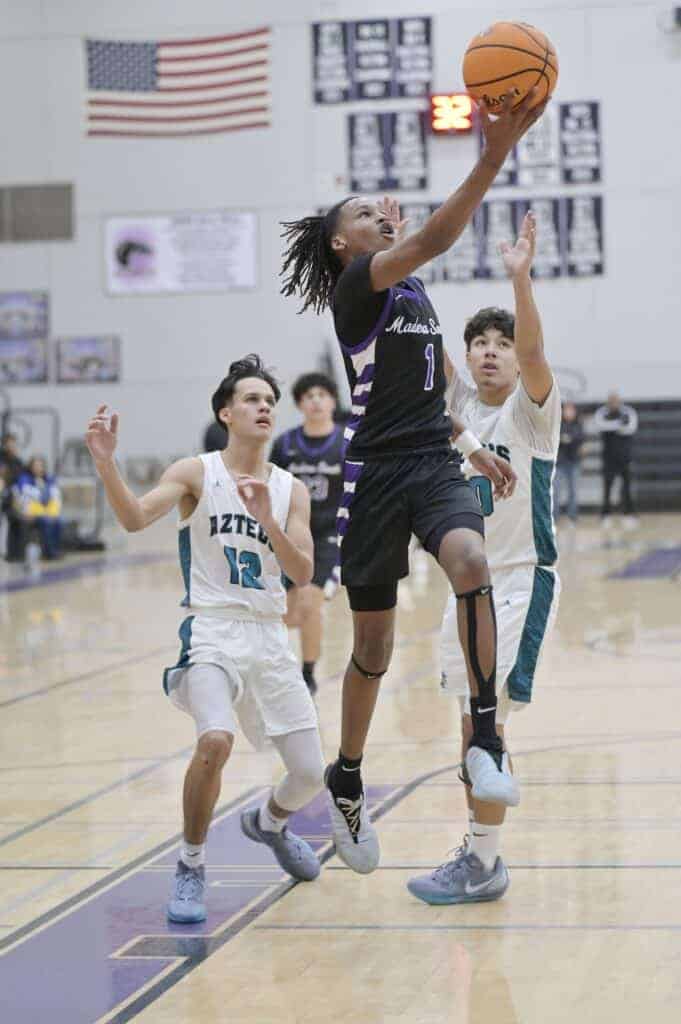 Photo - Madera South’s Maurice Snowden drives to the lane to score two of his game-high 23 points in Wednesday’s victory over the Mendota Aztecs. Snowden pulled down seven rebounds and hit five 3-pointers.