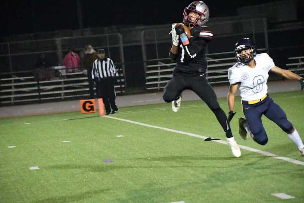 Photo - Matilda Torres receiver Angel Pereida catches the first of three touchdowns in Friday’s overtime loss. Pereida scored on touchdowns of 31, 21 and 25 yards.