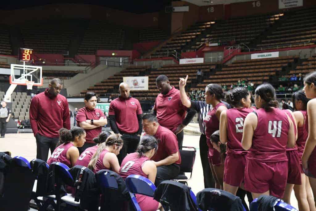 Photo - Matilda Torres Toros head coach Jose Villalobos (seated) gives instructions to his team during a time out in the Div. VI Central Section championship game on Friday.