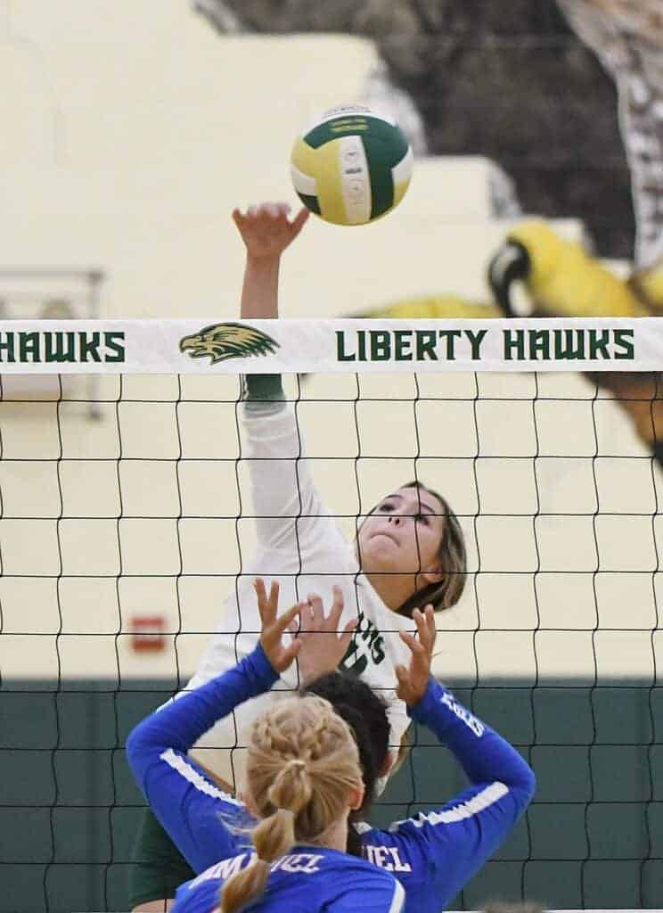 Photo - Liberty’s Karsyn Bauer rises up for one of her 10 kills during Tuesday’s four set victory over the Immanuel Eagles.