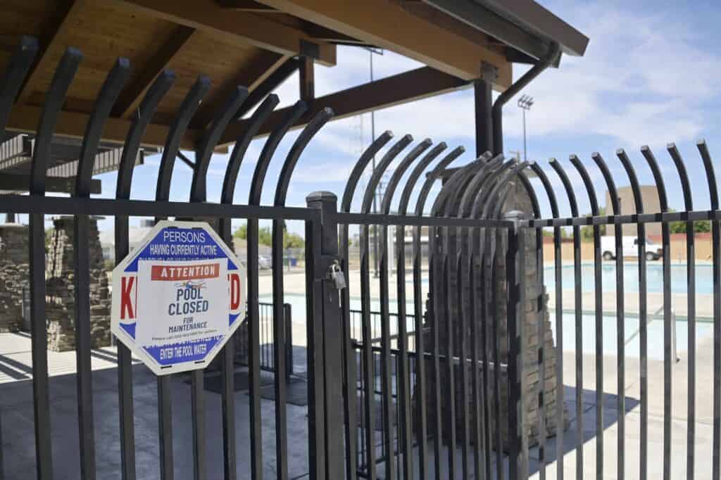 Photo - A closed sign is posted at the Centennial Pool Complex.