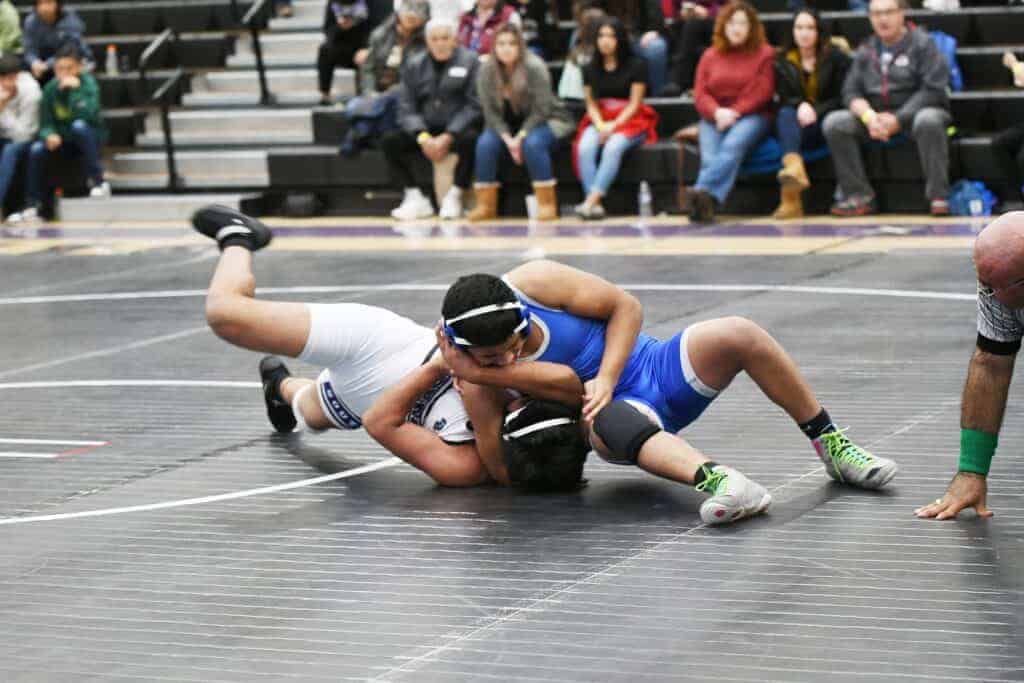 Photo - Madera’s Isaac Contreras tries to get Madera South’s Edgar Ortiz into a pinning position during the 160-pound match Wednesday. Contreras eventually got the pin, which secured a dual match victory over the Stallions.