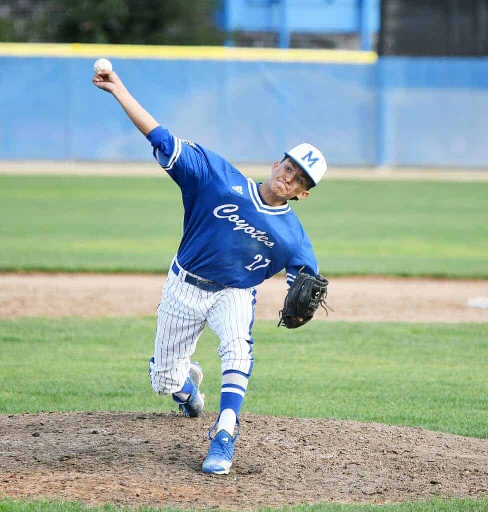 Photo - Madera’s Nikayha Castro throws a pitch during Friday’s 12-4 victory over the Kerman Lions. Not only did he pick up the win with four relief innings, he also had three hits, scored two runs and drove in another.