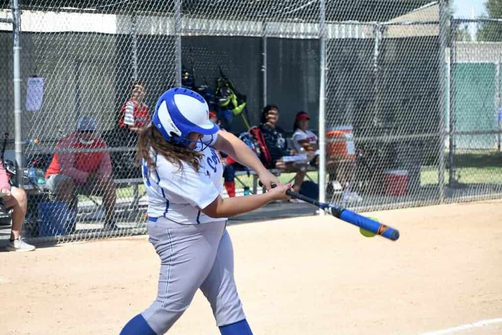 Photo - Madera’s Aislynn Jordan connects for a three-run home run during the Coyotes’ 16-0 victory over the San Joaquin Memorial Panthers.