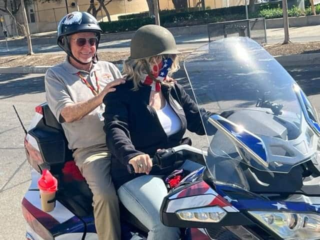 Photo - David F., 96, takes a practice ride on the back of a motorcycle. He will ride the motorcycle during the Veterans Day parade this year in Fresno.