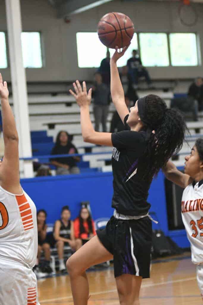 Photo - Madera South guard Aleecia Rosel rises up for a shot against Coalinga during an overtime win Wednesday in the Madera Shootout.