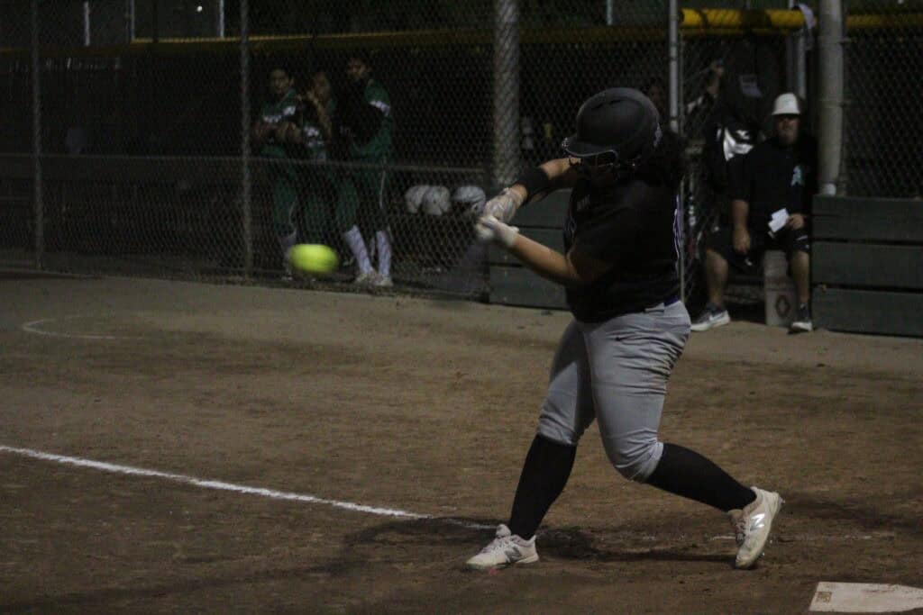 Photo - Madera South’s Elena Garica connects with a pitch during Monday’s comeback victory over Riverdale.