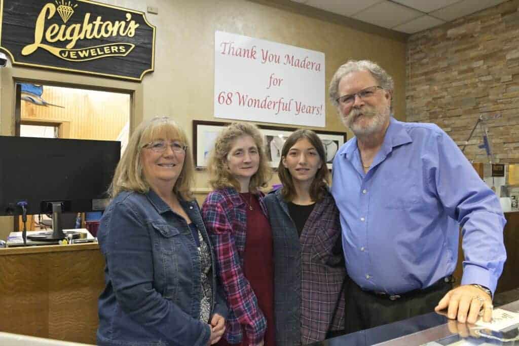 Photo - Chris Miller and Kim Miller of Leighton’s Jewelers along with their daughter, Suzie Gran and granddaughter, Lexi Behrman pose during the start of their closing business sale.